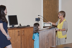 Mayor Amy Brewer presenting Miya with an award.